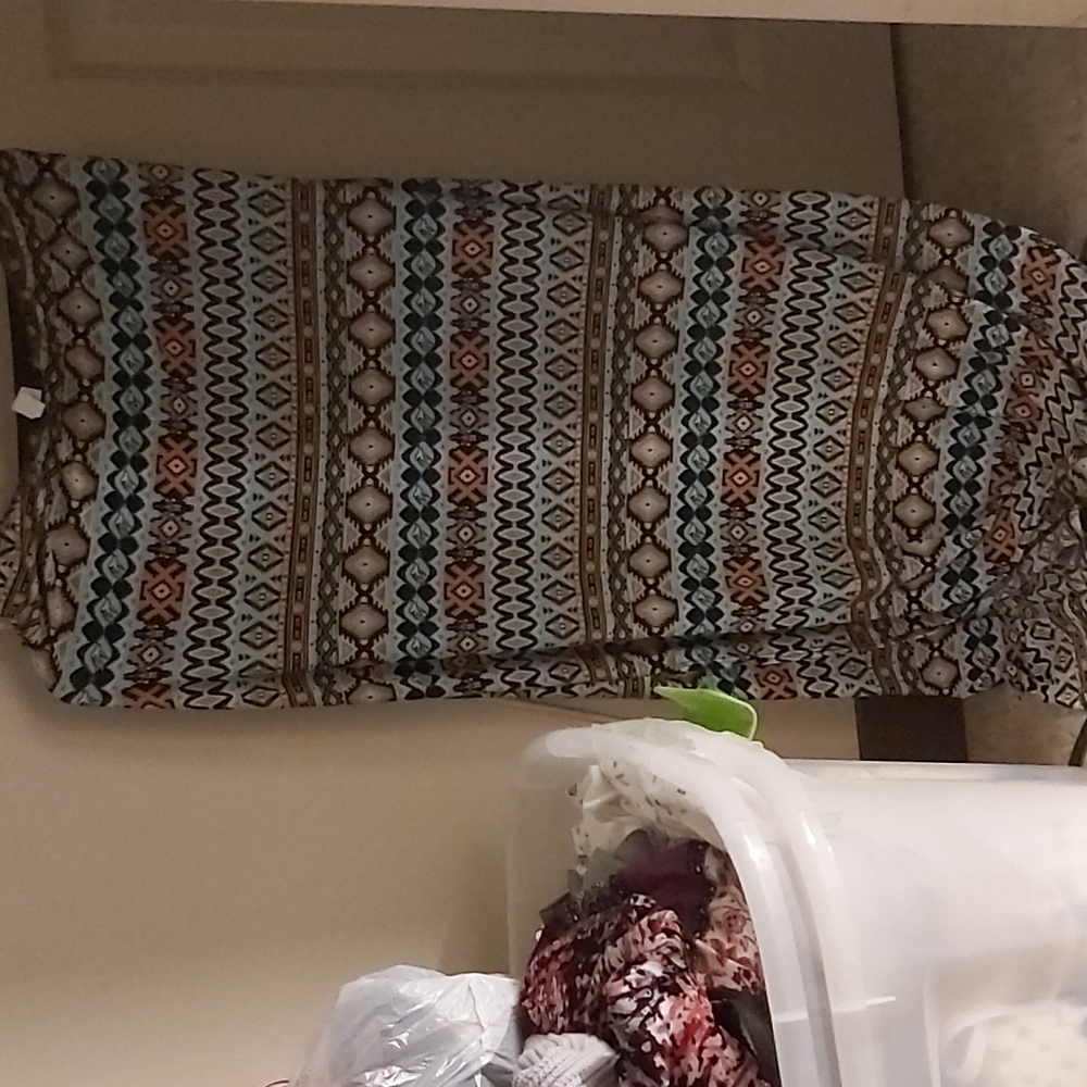 A Semi- Long, Delicate Skirt With A Patterned Design W- Vbrant Orange Blouse